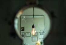 What to Expect from Mental Health Counseling: A Complete Guide Cracked mirror reflecting shadowy figure, floating paper airplane with fireflies