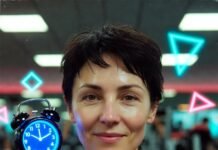 The 10 Best Fitness Apps for a Customized Workout Routine Sweaty retro alarm clock smartwatch on neon flamingo towel