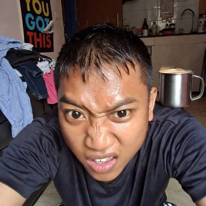 Sweaty selfie during failed plank in messy living room