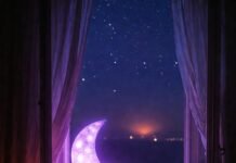 Sleep Hygiene: How to Create the Perfect Sleep Environment Dreamy messy bedroom with glowing moon lamp and city night glow.